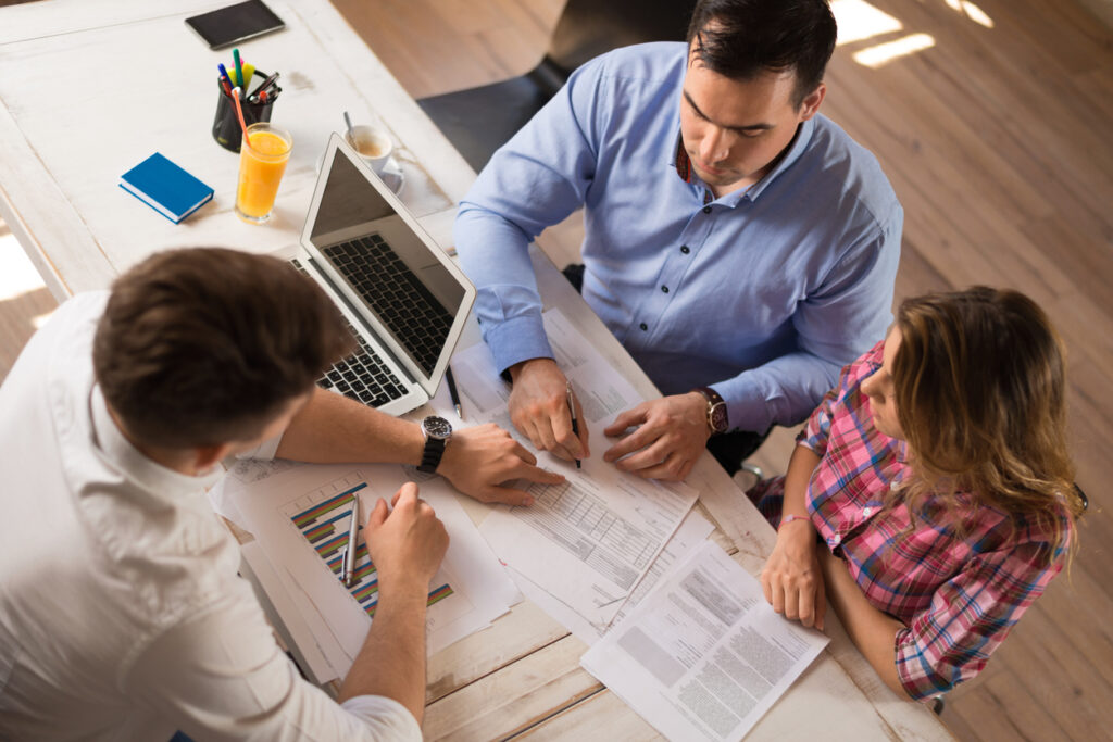 People meeting with property manager for financial management